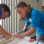 Blue camper folding her fuselage